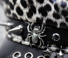 Sterling™ Nocturne Flat Top PU Leather Cap With Leopard Rivet Detail