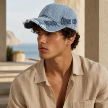 Sterling Distressed Denim Cap™ With “Never Give Up” Stitching