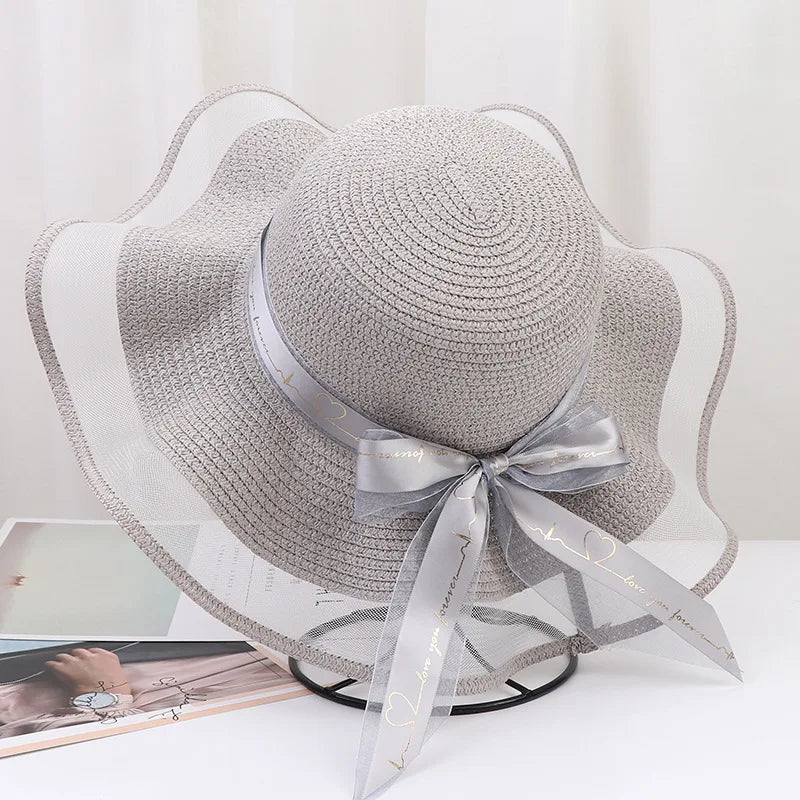 Sterling Straw Hat with Poppy Ribbon™ Wide Brim Woven Bow Detail