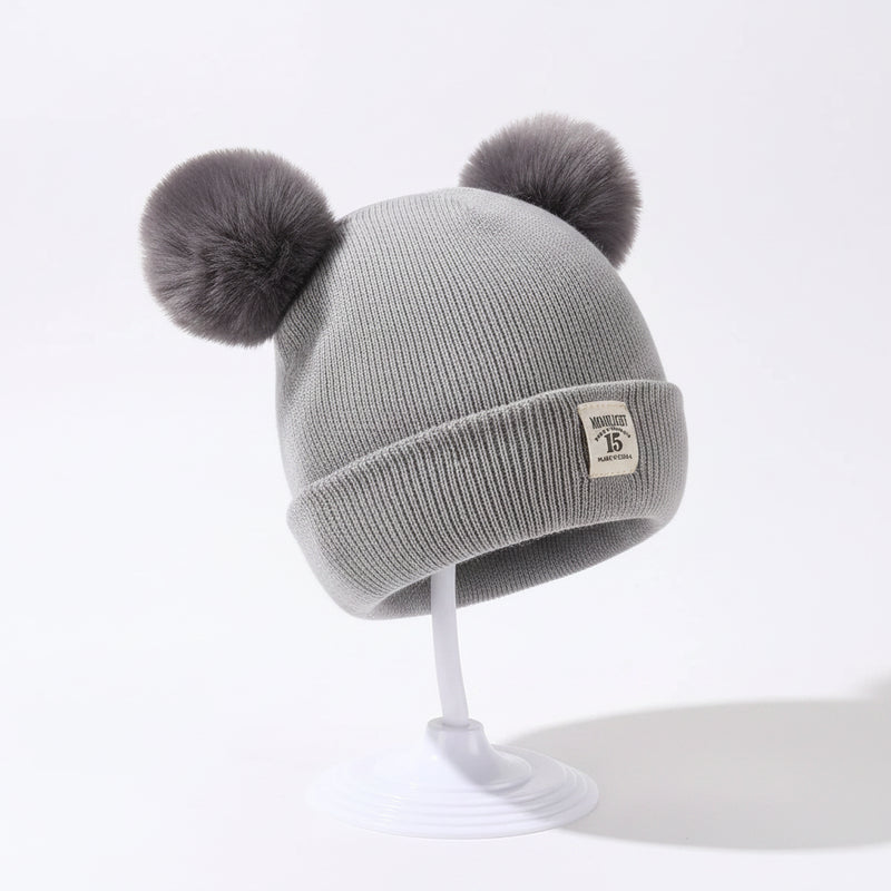 Sterling TeddyPuff Baby Knit Beanie™ Double Pom Bear Detail