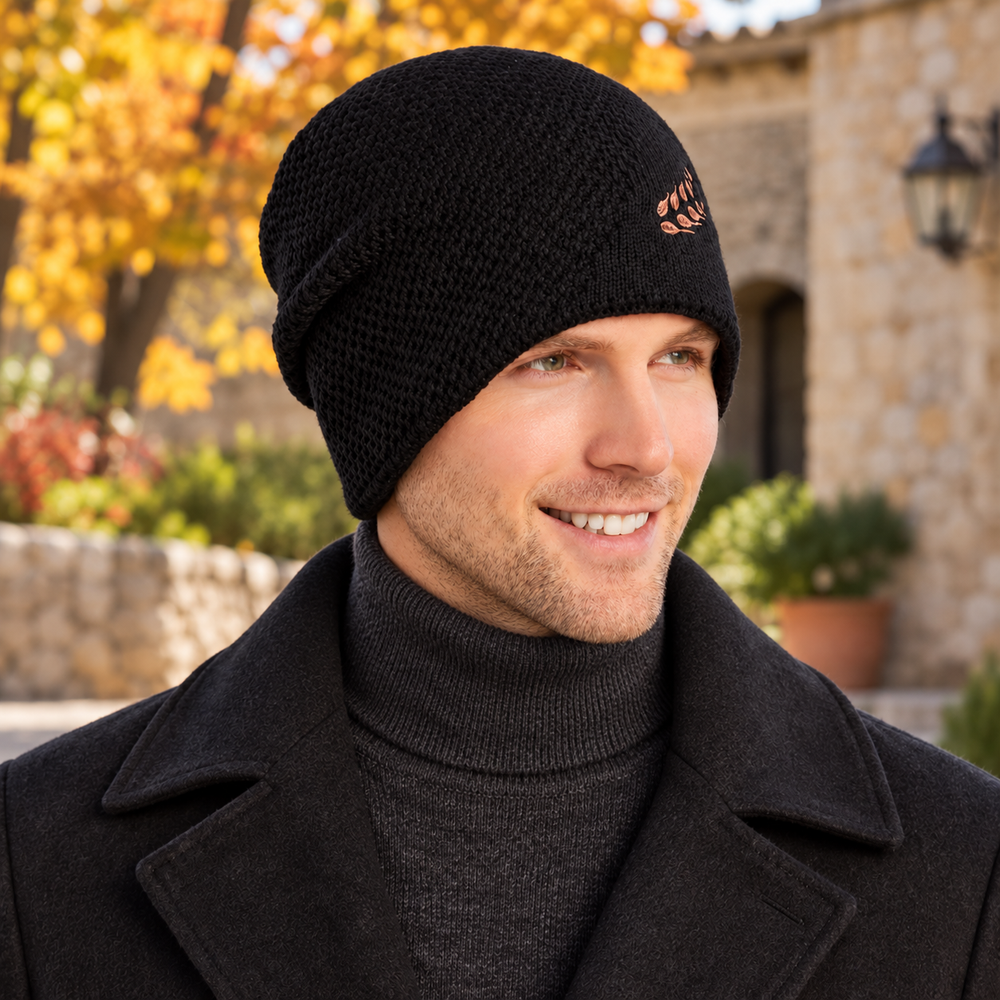 Man wearing the black Sterling Wheat-Detail knit winter hat with a charcoal sweater and classic overcoat outdoors in autumn